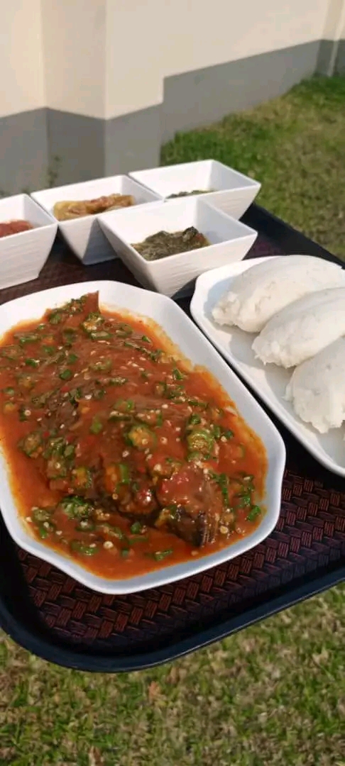 Fish stew with nshima and relishes
